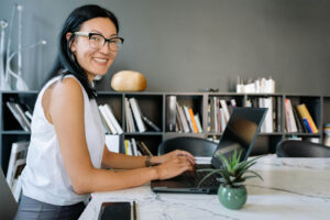 Asian-Woman-On-Laptop-8837201